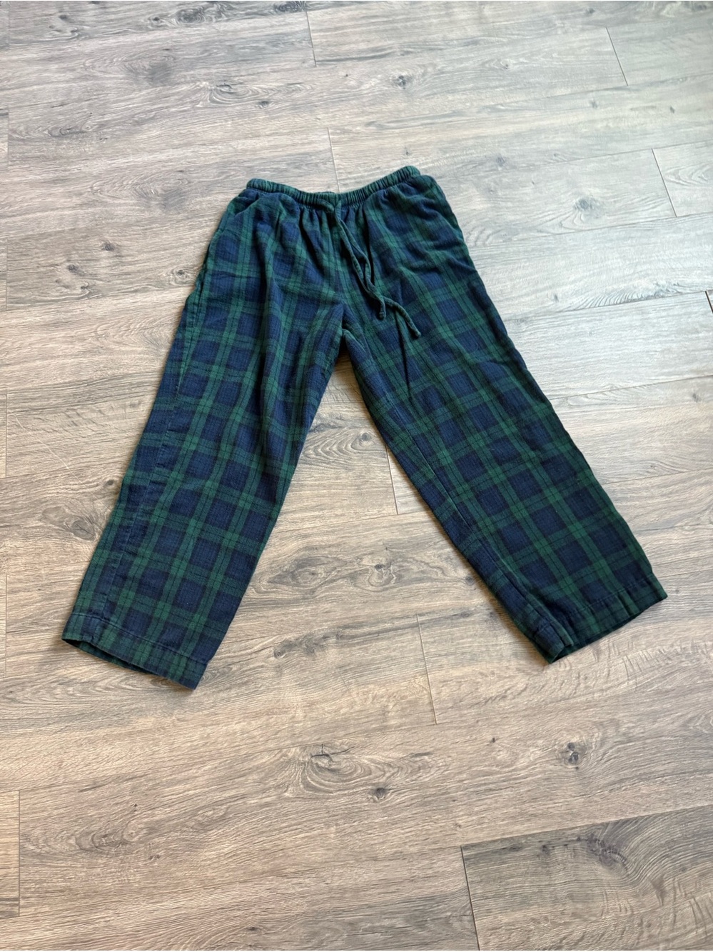 L.L.Bean womenโs plaid pants in a classic green and navy tartan pattern.
